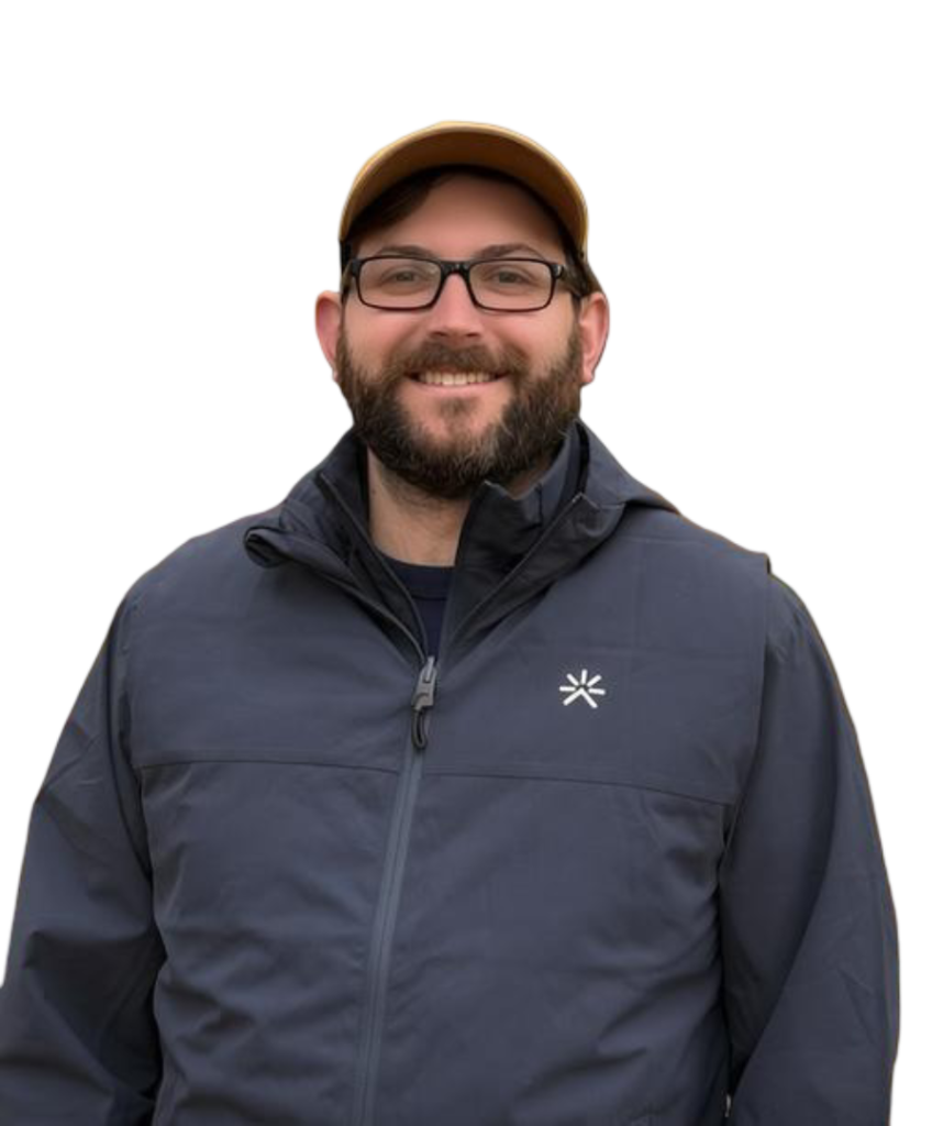 Ian, the guy who will help you. copy Ian, founder & CEO of Occam's Razor Digital Marketing headshot wearing a hat and rain jacket.