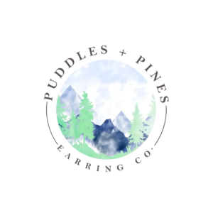 Puddles & Pines Earring Company. A nature-themed logo with mountains and trees.